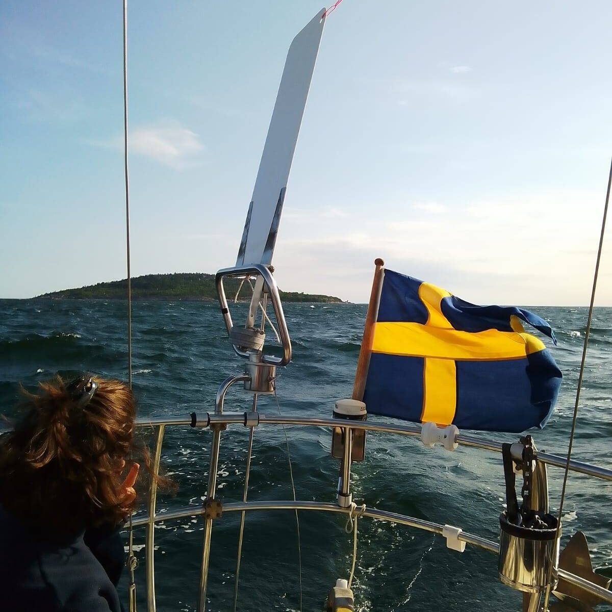 steering swedish flag leaving island